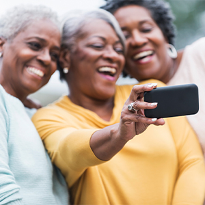 middle-aged women taking a selfie